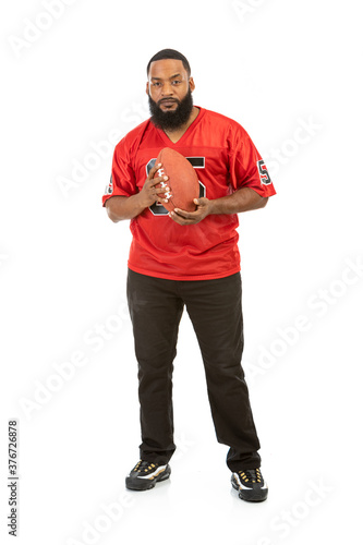 Fan: Man In Red Team Jersey With Football