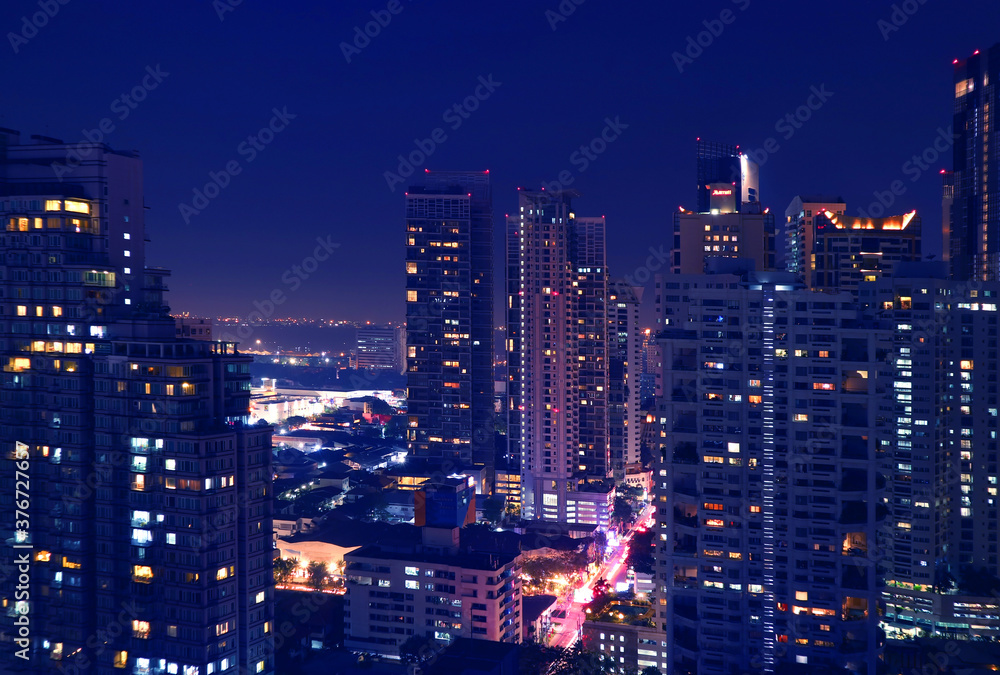 Fantastic Aerial View of Downtown Bangkok with Skyscrapers at Night in Deep Blue Color