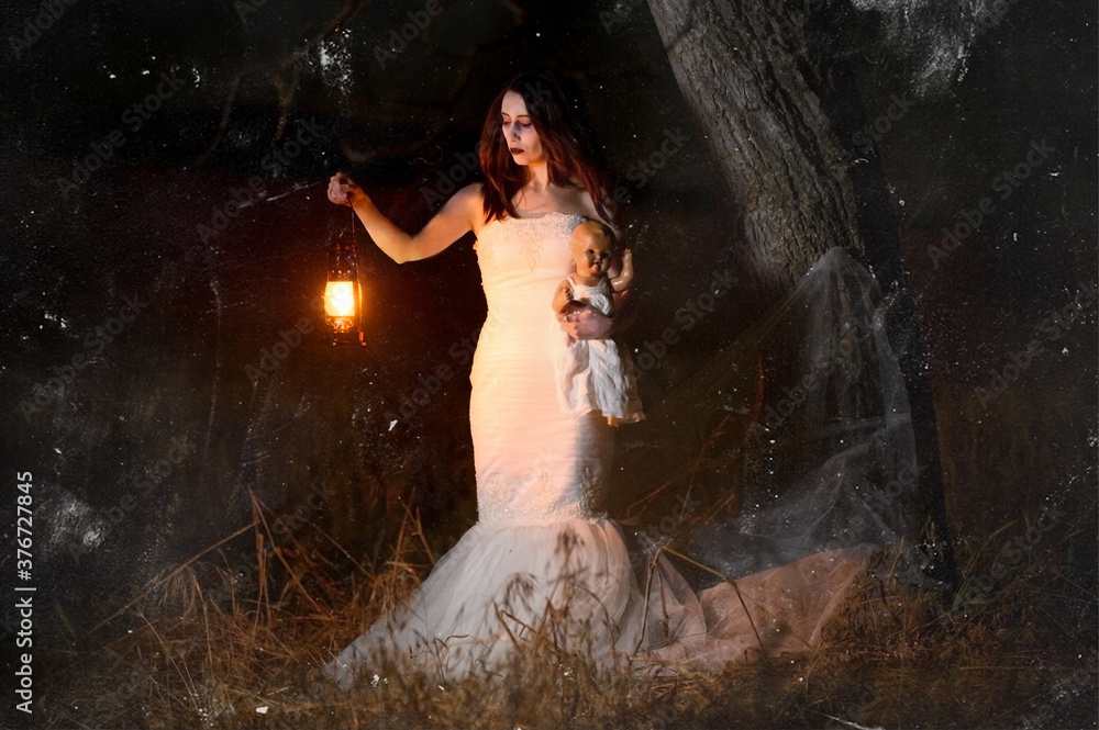 Scary woman with a lantern in night scene - Spooky image of a scary ...