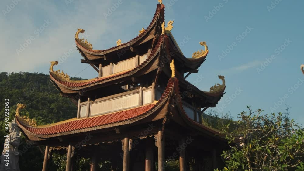 Ho Quoc Pagoda against green trees and blue sky