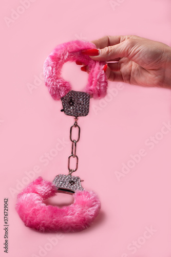 on a pink background sex product, toy for adults