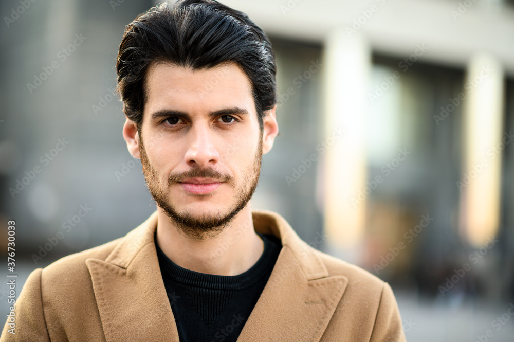 Fototapeta premium Handsome young man outdoor in casual elegant cloths