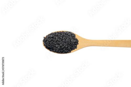 black sesame in wood spoon isolated on white background. full depth of field