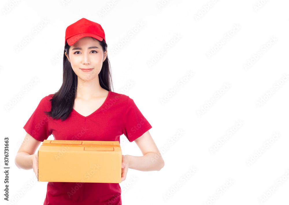 Delivery woker in red uniform isolated on white background, copy space. Woman in cap, t-shirt working as courier or dealer holding parcel box. Receiving package. delivery service and shipment concept Delivery woker in red uniform isolated on white background, copy space. Woman in cap, t-shirt working as courier or dealer holding parcel box. Receiving package. delivery service and shipment concept