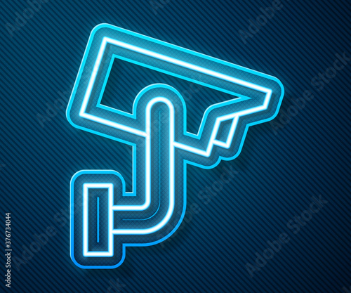 Glowing neon line Security camera icon isolated on blue background. Vector Illustration.