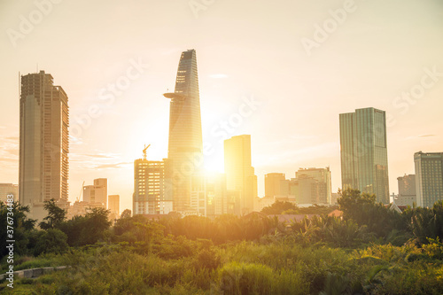 Beautiful landscape sunset of Ho Chi Minh city or Sai Gon, Vietnam. Bitexco Financial Tower and skyscraper buildings. Business and landscape concept. photo