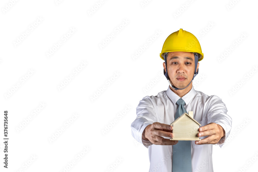 Portrait asian engineer wear a shirt and safety helmet holding wood house model in hand isolated on white background with clipping path selective focus at hand Portrait asian engineer wear a shirt and safety helmet holding wood house model in hand isolated on white background with clipping path selective focus at hand