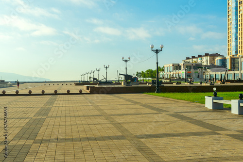 Fototapeta Naklejka Na Ścianę i Meble -  The city of Novorossiysk, embankment of Novorossiysk Bay area forum early in the morning