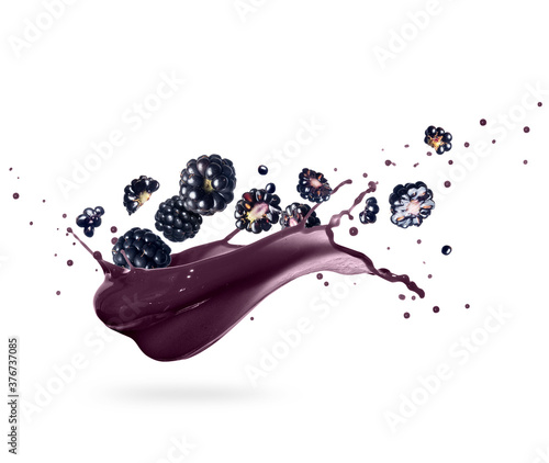 Fotografie Ripe blackberries with splashes of juice, isolated on white background