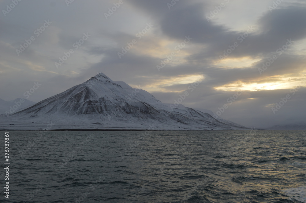 Winter sunset over the ice fjords of the Archipelago of Svalbard (Spitsbergen) in Norway