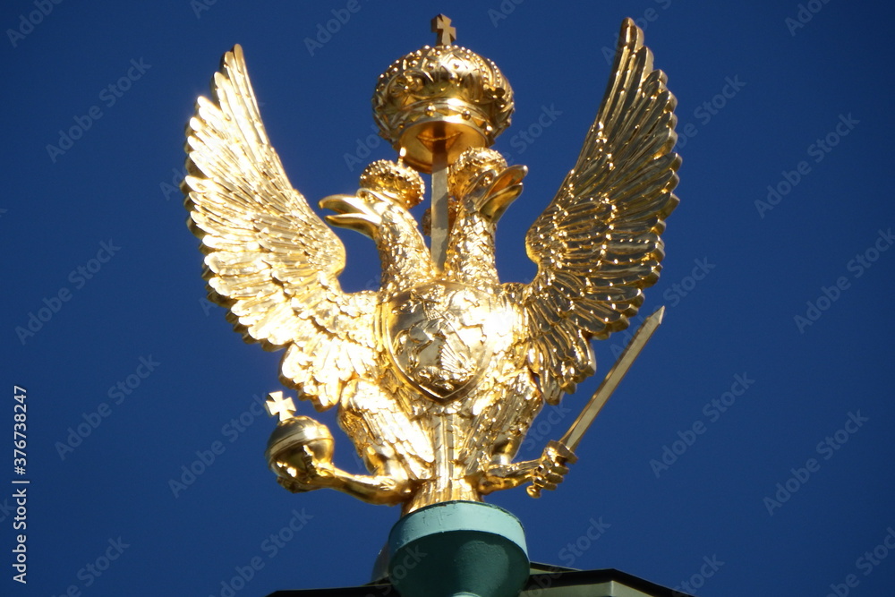 Golden double-headed eagle on the roof of the Winter Palace, Saint Petersburg Golden double-headed eagle on the roof of the Winter Palace, Saint Petersburg