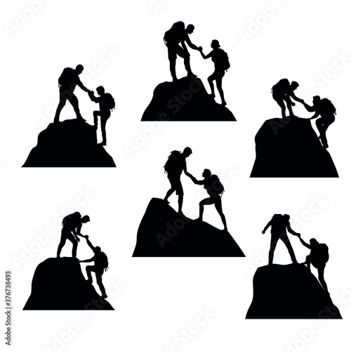 Fotobehang Silhouettes Set Of Climbers Helping Each Other