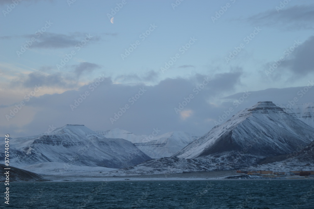 Sunset in the ice fjords of the Norwegian Archipelago of Svalbard (Spitsbergen), Norway Sunset in the ice fjords of the Norwegian Archipelago of Svalbard (Spitsbergen), Norway