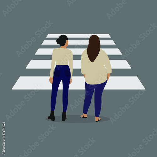 Two female characters face a pedestrian crossing