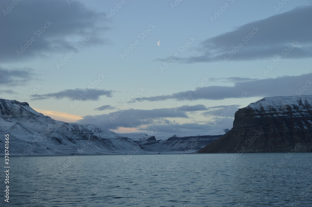 Sunset in the ice fjords of the Norwegian Archipelago of Svalbard (Spitsbergen), Norway Sunset in the ice fjords of the Norwegian Archipelago of Svalbard (Spitsbergen), Norway