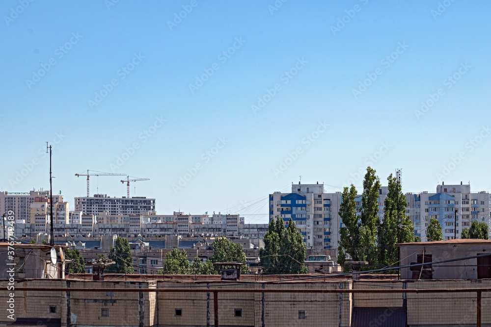 Bird's Eye View of One of the Residential Areas of Odessa. The Photo Shows the Roofs of Multi-Storey Buildings, A New Building and Lifting Cranes