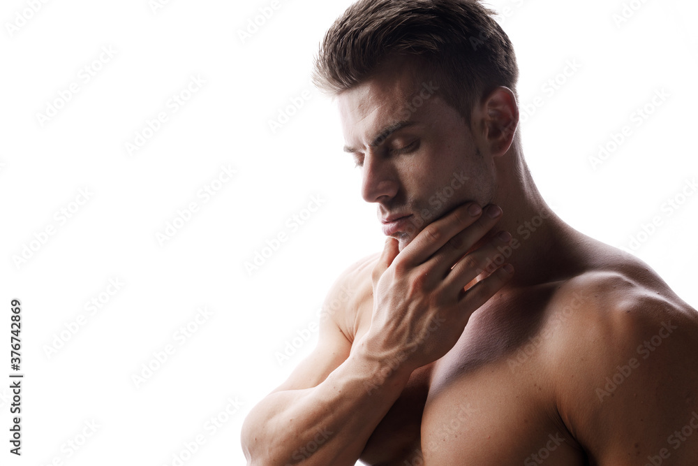 Muscular sexy model sports young man on white background. Portrait of beautiful healthy guy. Muscular sexy model sports young man on white background. Portrait of beautiful healthy guy.
