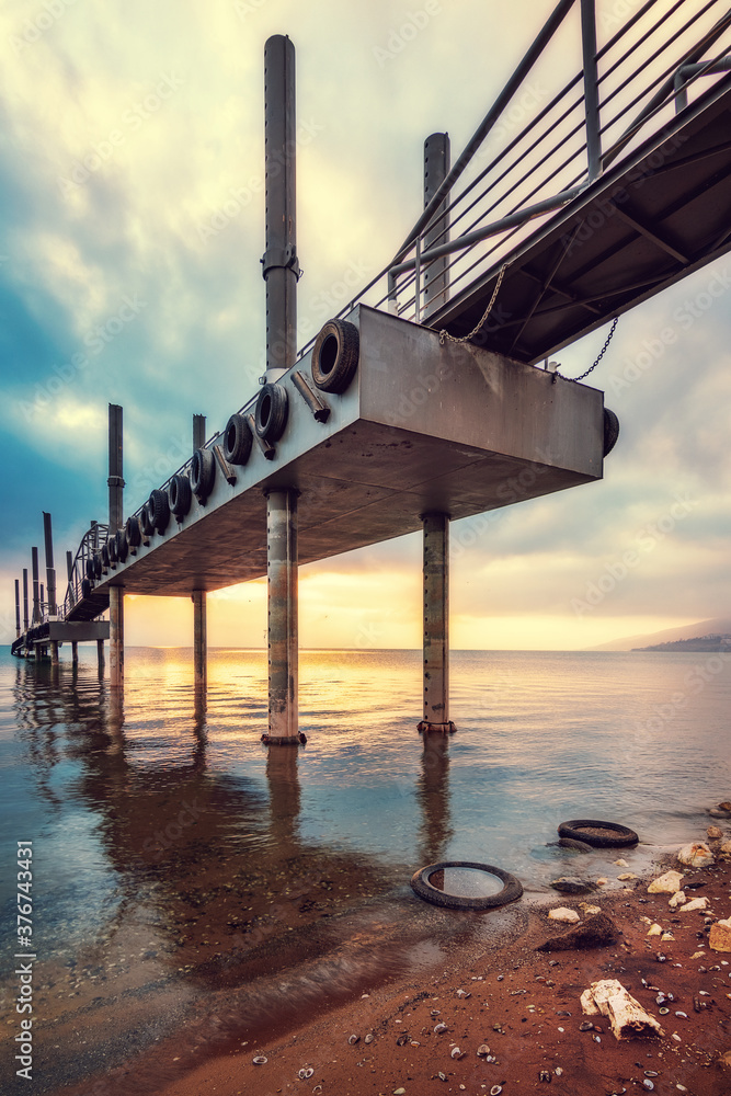 A pier on the coast of Lake Kinneret on the Ginosar beach.