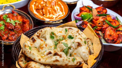assorted indian curry and rice dishes .Indian food shot from top view.