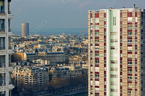 Aerial view of apartments and cityscape of Paris at dusk