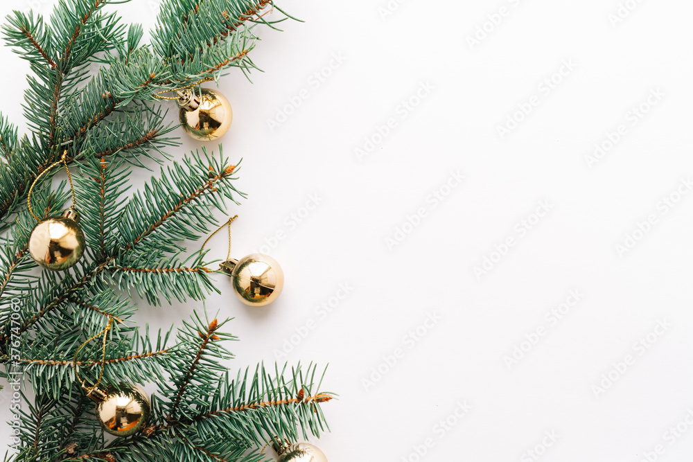 Christmas or new year's background, plain composition of Christmas golden toys and fir branches, Flatlay, empty space for greeting text.christmas concept Christmas or new year's background, plain composition of Christmas golden toys and fir branches, Flatlay, empty space for greeting text.christmas concept