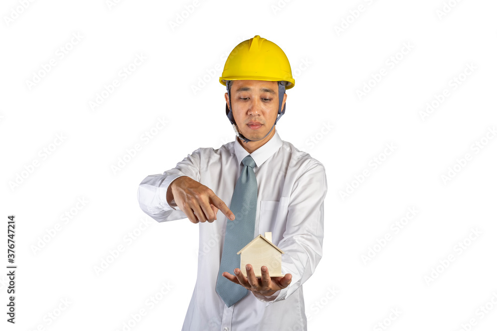 Portrait asian engineer wear a shirt and safety helmet finger point to wood house model holding in hand isolated on white background with clipping path selective focus at hand Portrait asian engineer wear a shirt and safety helmet finger point to wood house model holding in hand isolated on white background with clipping path selective focus at hand