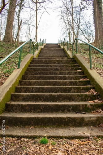 Looking Up Concrete Steps With a Green Railing in a Suburban Park in Pennsylvania