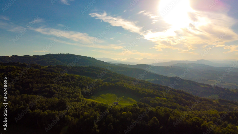 Fototapeta premium Aerial landscape from the drone of italian Appennini mountains, with trees, meadows and fields