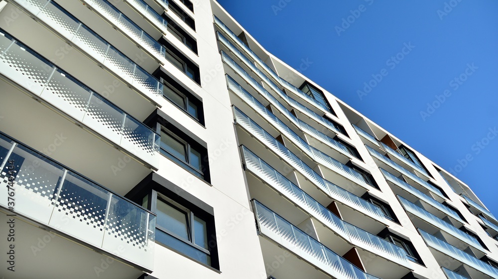Architectural details of modern apartment building. Modern european residential apartment building complex. Architectural details of modern apartment building. Modern european residential apartment building complex.