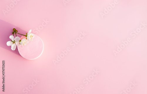 Cosmetic sponges in pastel colors on a pink background