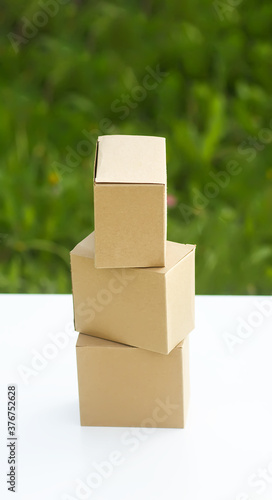 Cardboard boxes on green grass outdoors