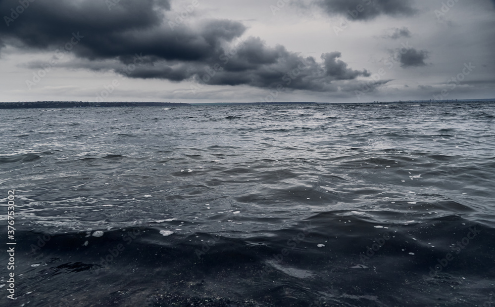 dark stormy sea and dramatic clouds, gloomy nature