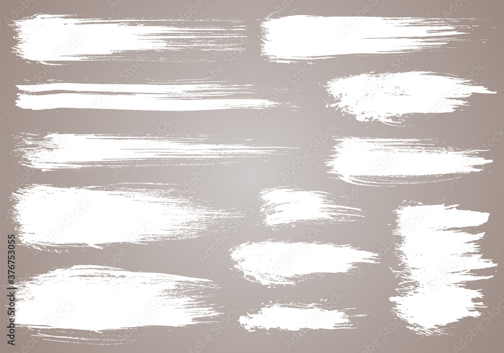 Obraz premium Paint brush. White ink grunge brush strokes. Vector paintbrush set. Grunge design elements. Painted ink stripes