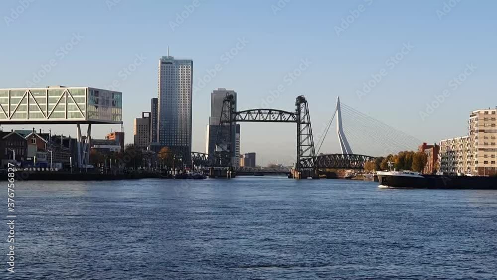 cityscape of Rotterdam with De Hef on the left and the Erasmus bridge on the right cityscape of Rotterdam with De Hef on the left and the Erasmus bridge on the right