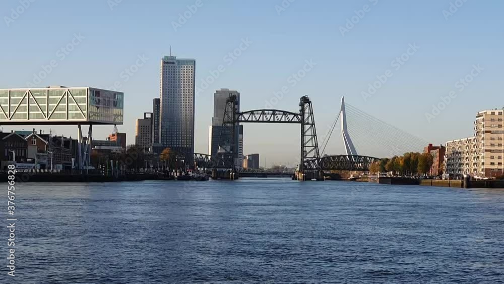 Views along the Kralingse Plas lake at sunrise in Rotterdam with skyline of the city, the Netherlands. Views along the Kralingse Plas lake at sunrise in Rotterdam with skyline of the city, the Netherlands.