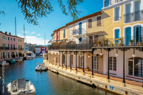 colorful houses and boats on a canal in Port Grimaud, on the French Riviera
