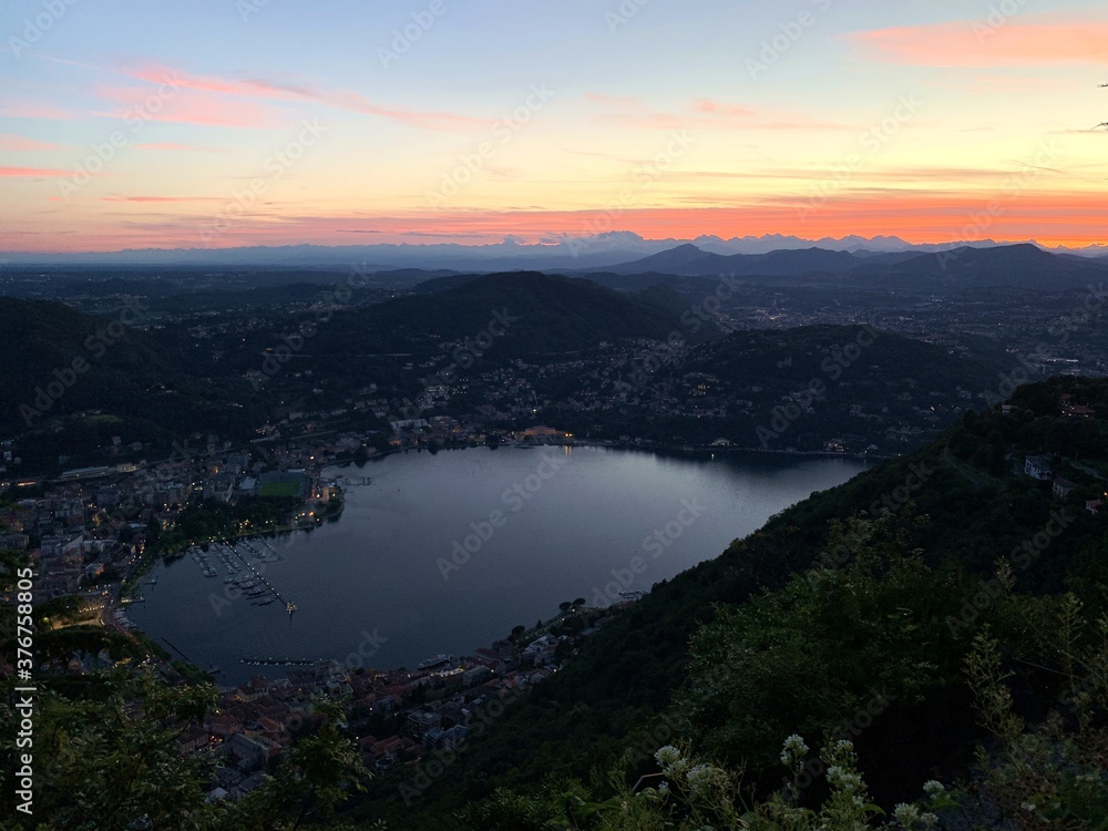 Panorama of Como city and lake from Brunate at sunset.