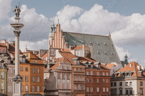 landscape from the square of the old town of Warsaw in Poland with the royal castle and tenement houses