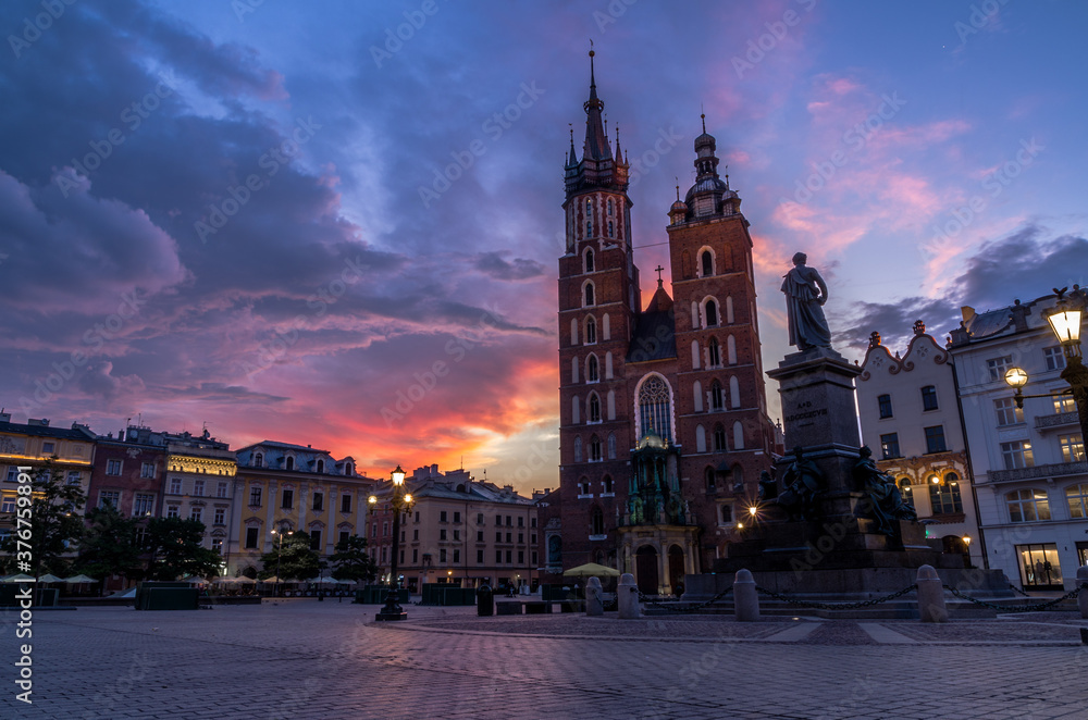 St. Mary's church and Adam Mickiewicz monumet before sunrise, Cracow, Poland