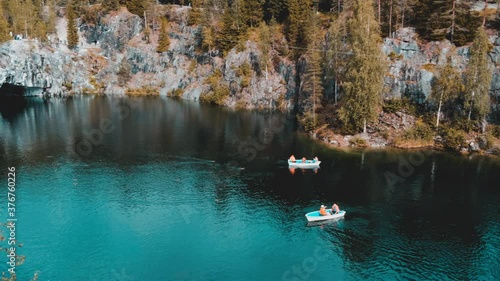 Boats swim on a lake in the mountains