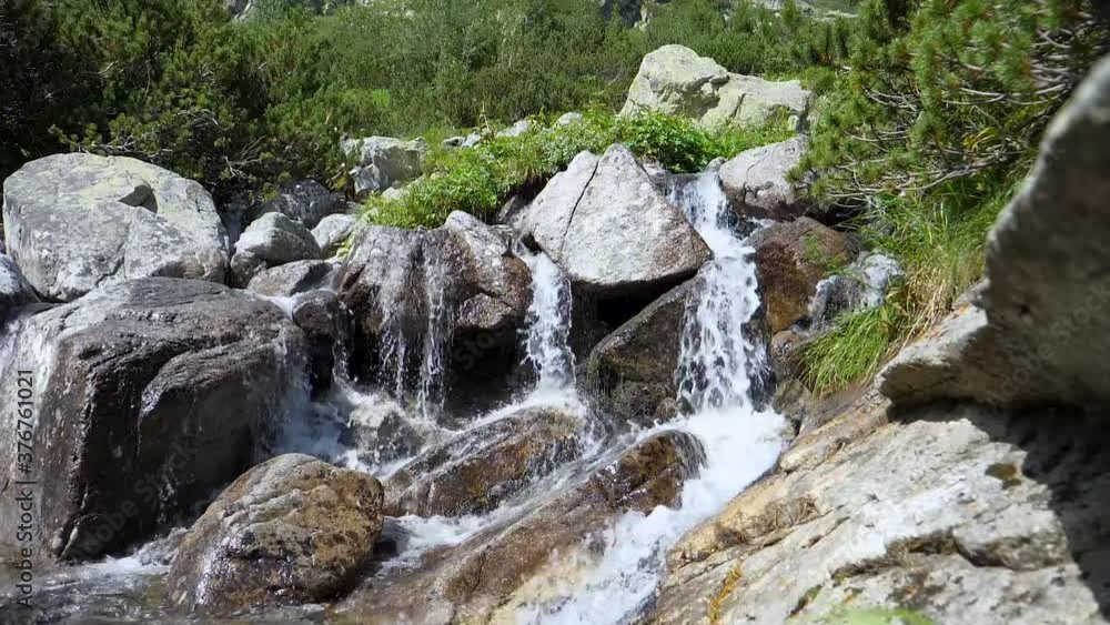 Mountain spring and river, slow motin water during hikinng Mountain spring and river, slow motin water during hikinng