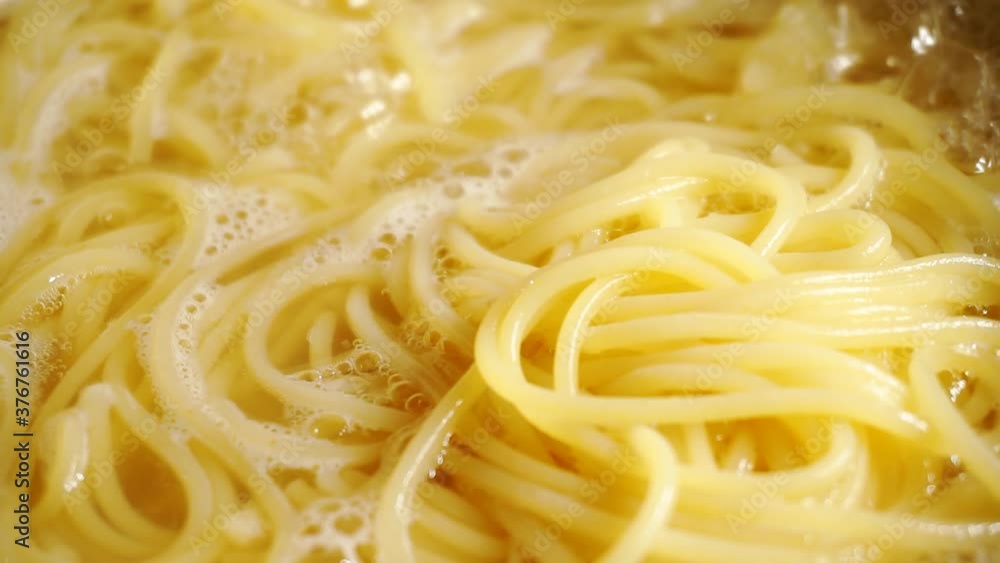 Close-up of spaghetti pasta In boiling hot water. Close-up of spaghetti pasta In boiling hot water.