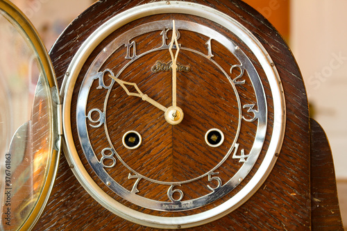 antique wooden ticking clock