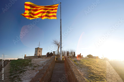 Catalan flag on Monthuic Castle on Montjuic hill, Barcelona, Spain photo