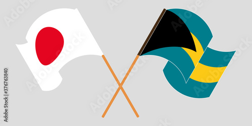 Crossed and waving flags of Bahamas and Japan