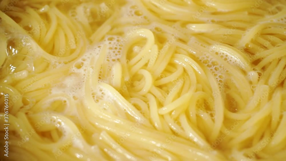 Close-up of spaghetti pasta In boiling hot water. Close-up of spaghetti pasta In boiling hot water.