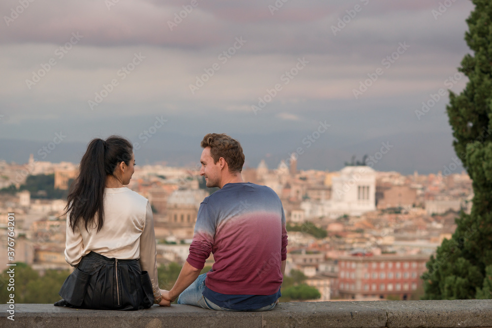 Couple enjoying sunset from Gianicolo Hill, Rome, Italy