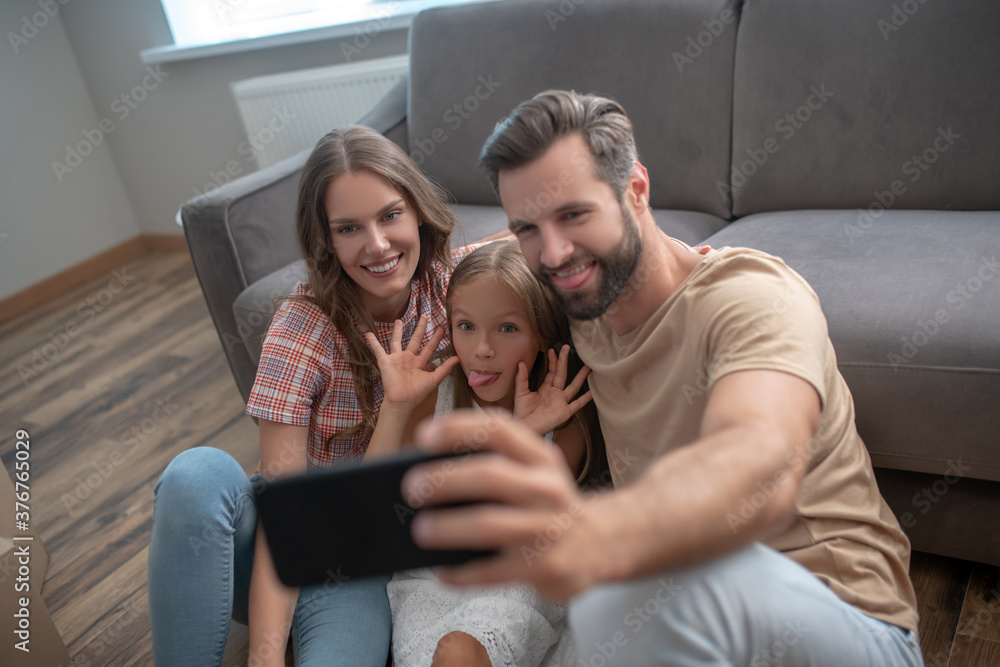 Happy family making photo and having fun Happy family making photo and having fun