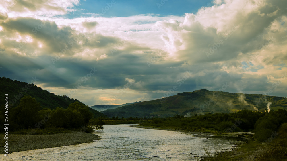 dramatic soft focus landscape scenic view of mountain in smoke and highland river evening contrast lighting photo dramatic soft focus landscape scenic view of mountain in smoke and highland river evening contrast lighting photo