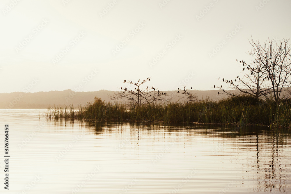 Calm view of lake at sunset, Flores, Guatemala, Central America Calm view of lake at sunset, Flores, Guatemala, Central America